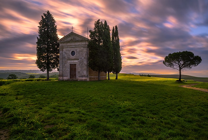 Chapel of Madonna di Vitaleta built in the middle of a hill. One of the most photographed churches in Tuscany